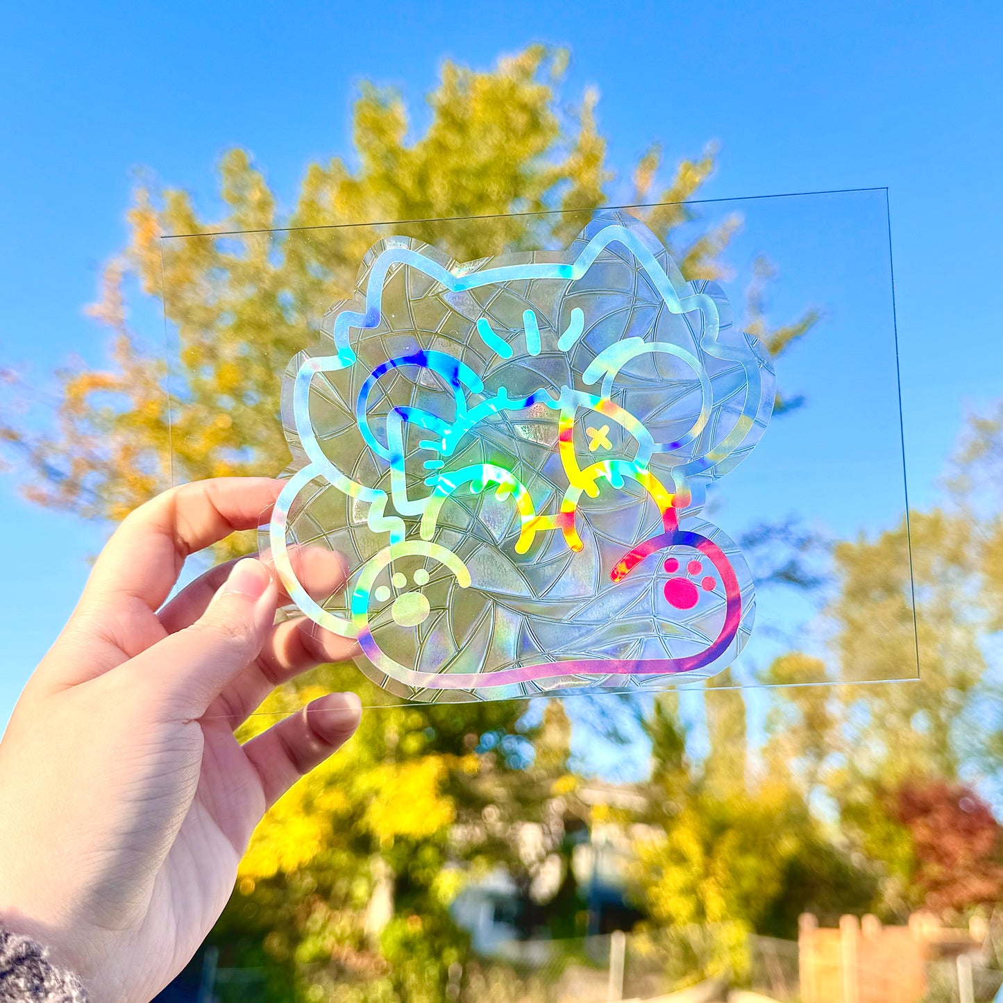 Cute cat eating fish Suncatcher