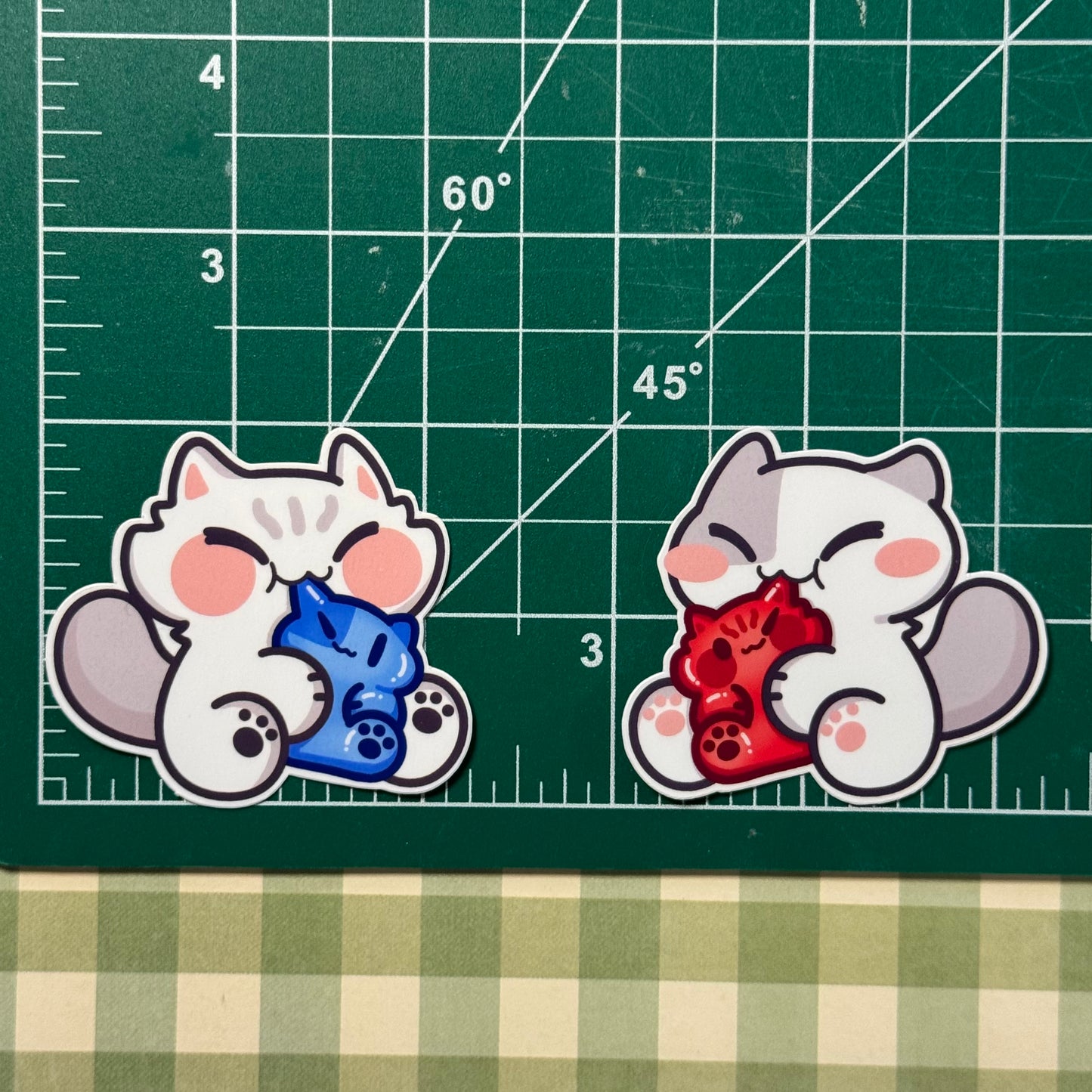 Cat eating gummy Stickers