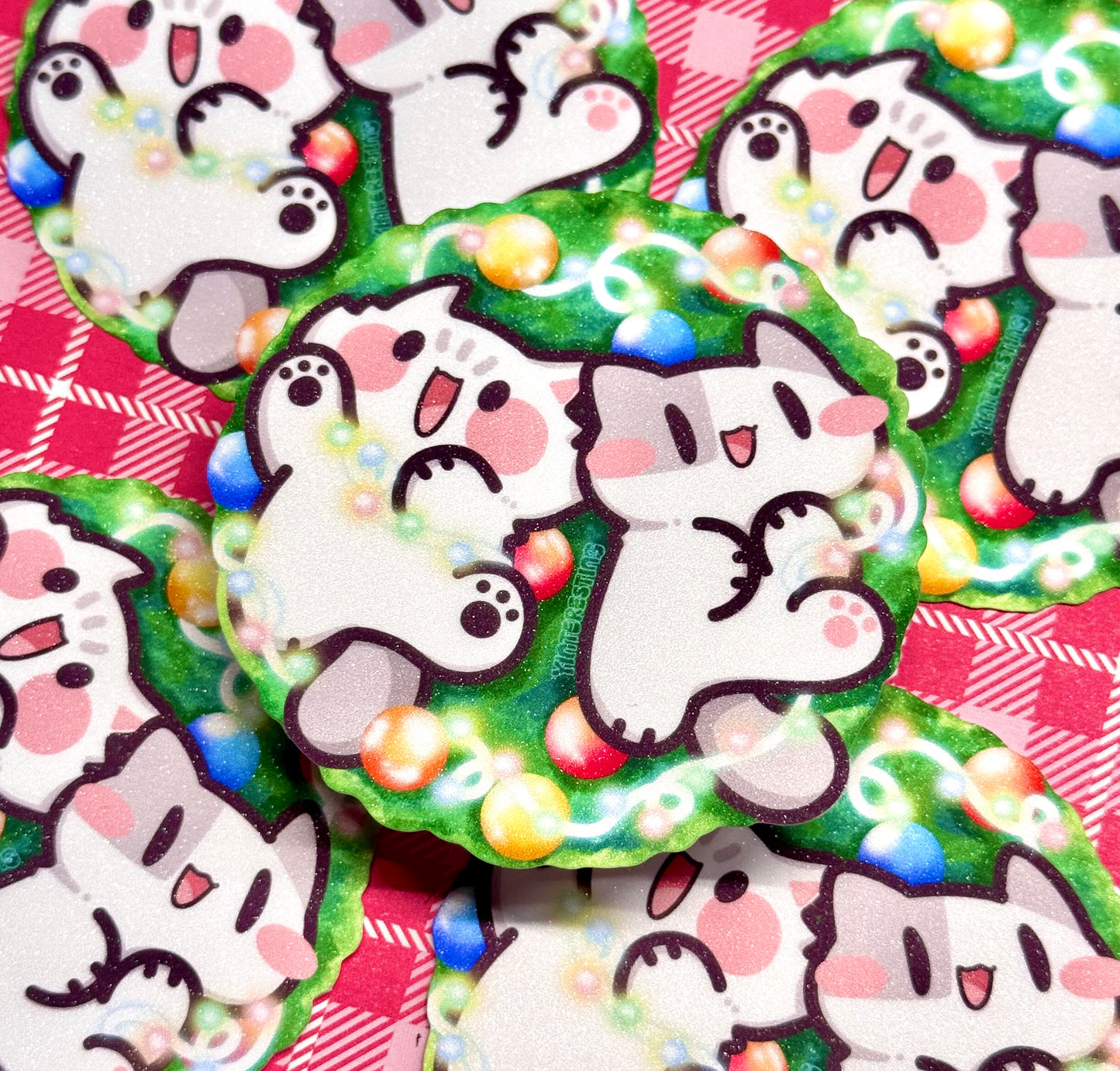 Meows playing with Christmas Lights Sticker