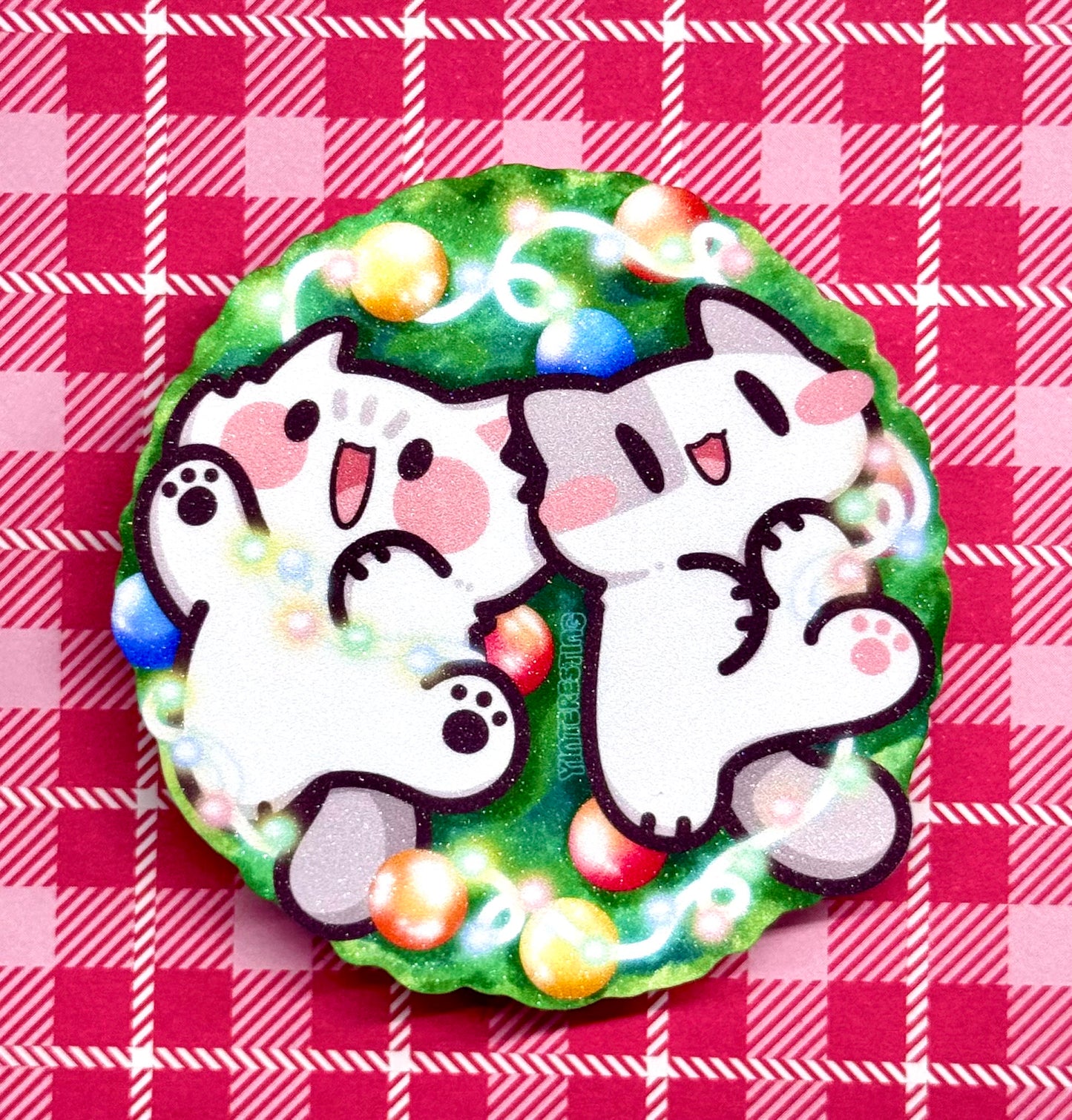 Meows playing with Christmas Lights Sticker