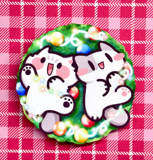 Meows playing with Christmas Lights Sticker