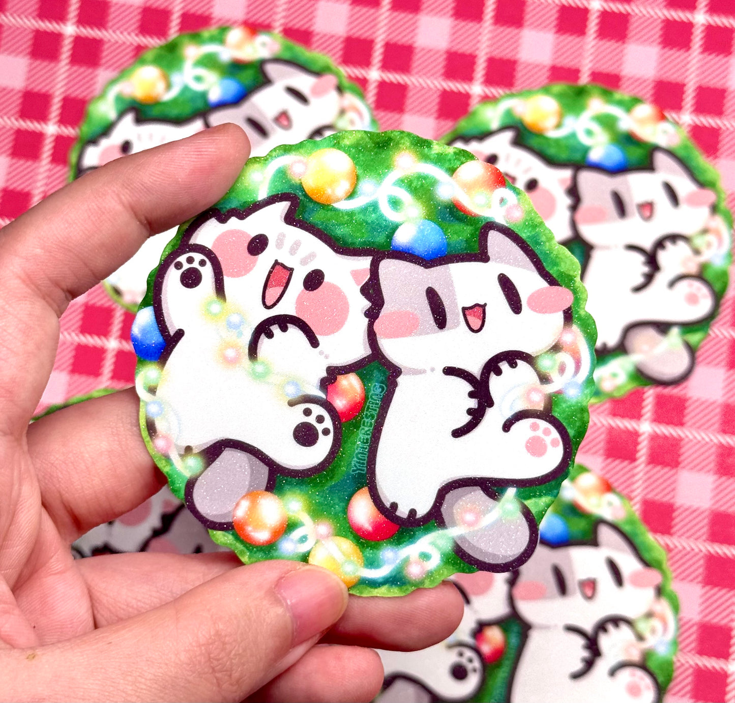 Meows playing with Christmas Lights Sticker